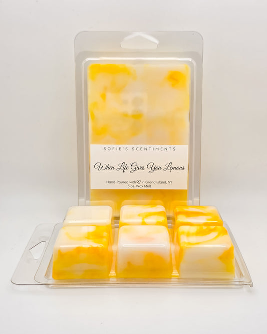 Front and back view of **When Life Gives You Lemons Wax Melt** – marbled yellow and white wax, highlighting the sweet lemon cake fragrance.
